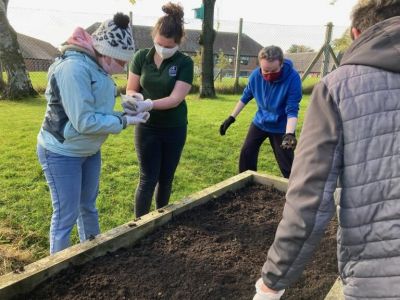 <strong>Carlisle Mencap</strong><br/>Carlisle Mencap members and staff doing some gardening tasks at Grace Little Centre as part of Safer Together & Recovering Together.
